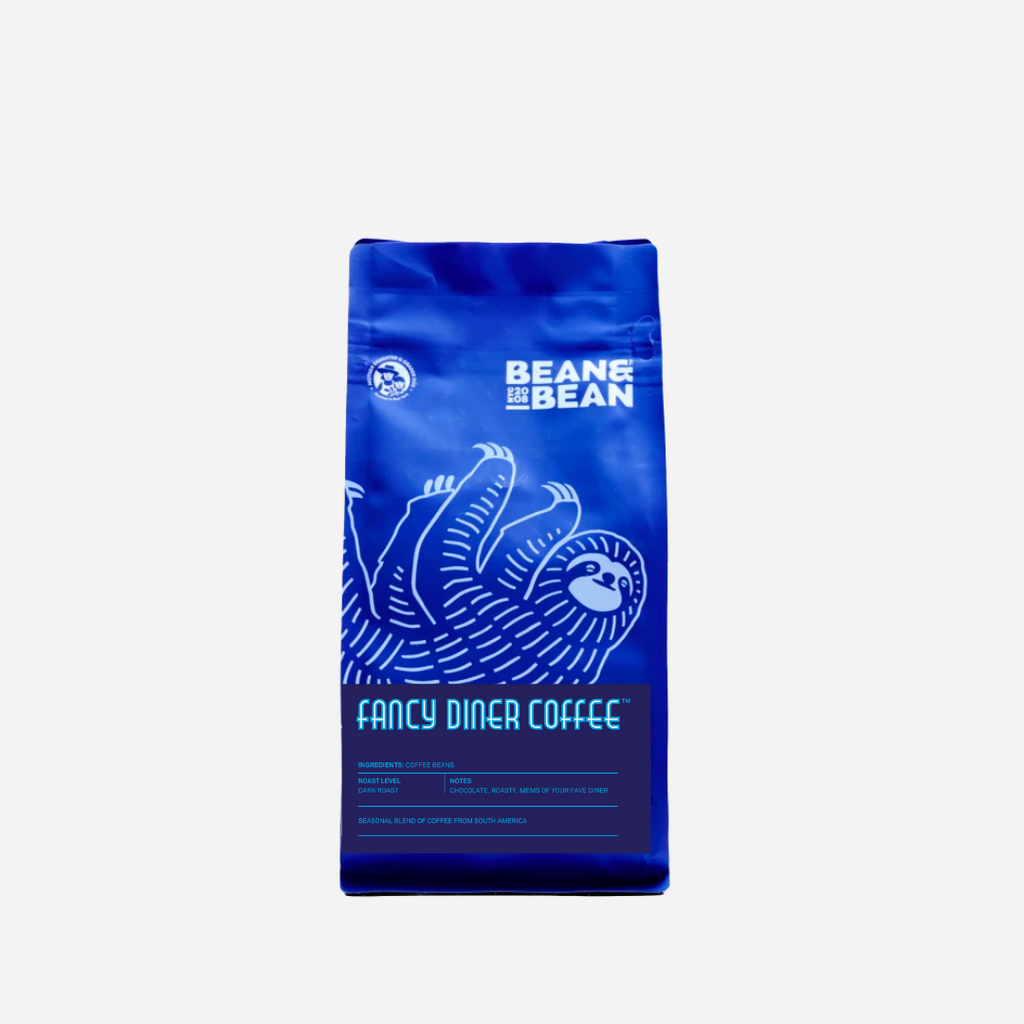 Purple "Bean & Bean Coffee Roasters" bag with a blue label that says "Fancy Diner Coffee"