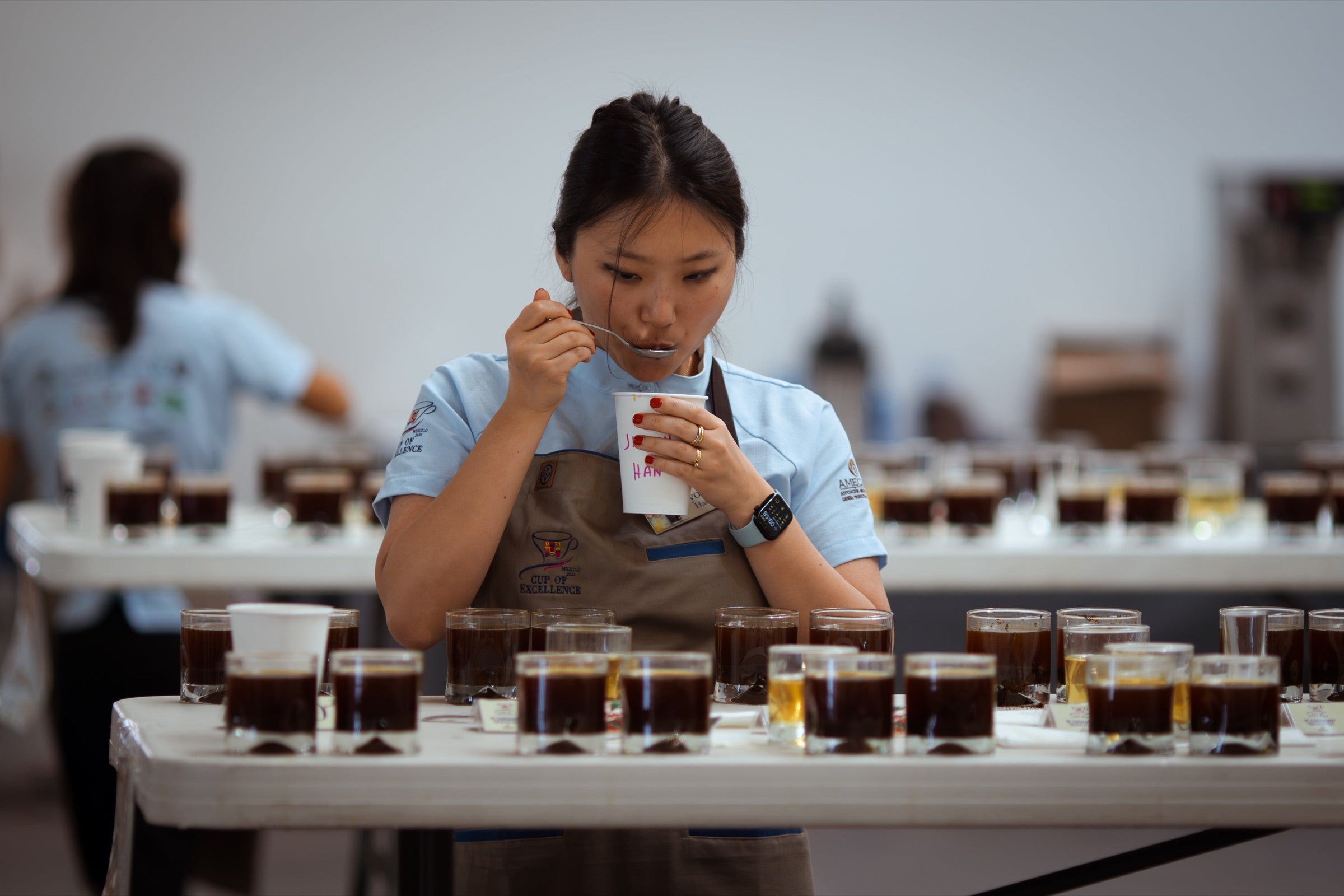 Jiyoon cupping at Cup of Exellence.