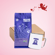 Purple "Bean & Bean Coffee Roasters" bag with a colored label that says Coffee And Camp Cup Gift Box