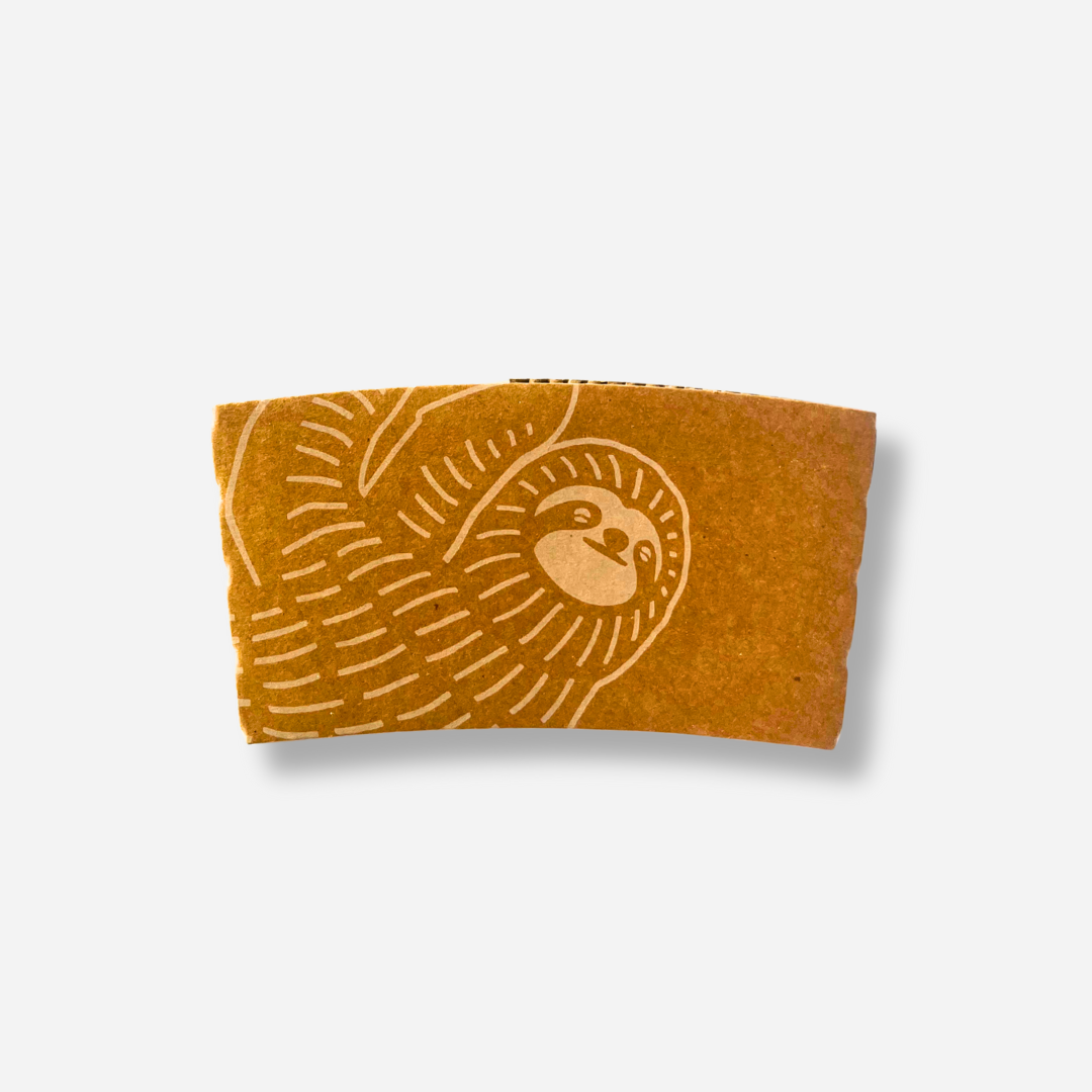 A brown craft coffee sleeve with a light sloth illustration wrapping around the left side.